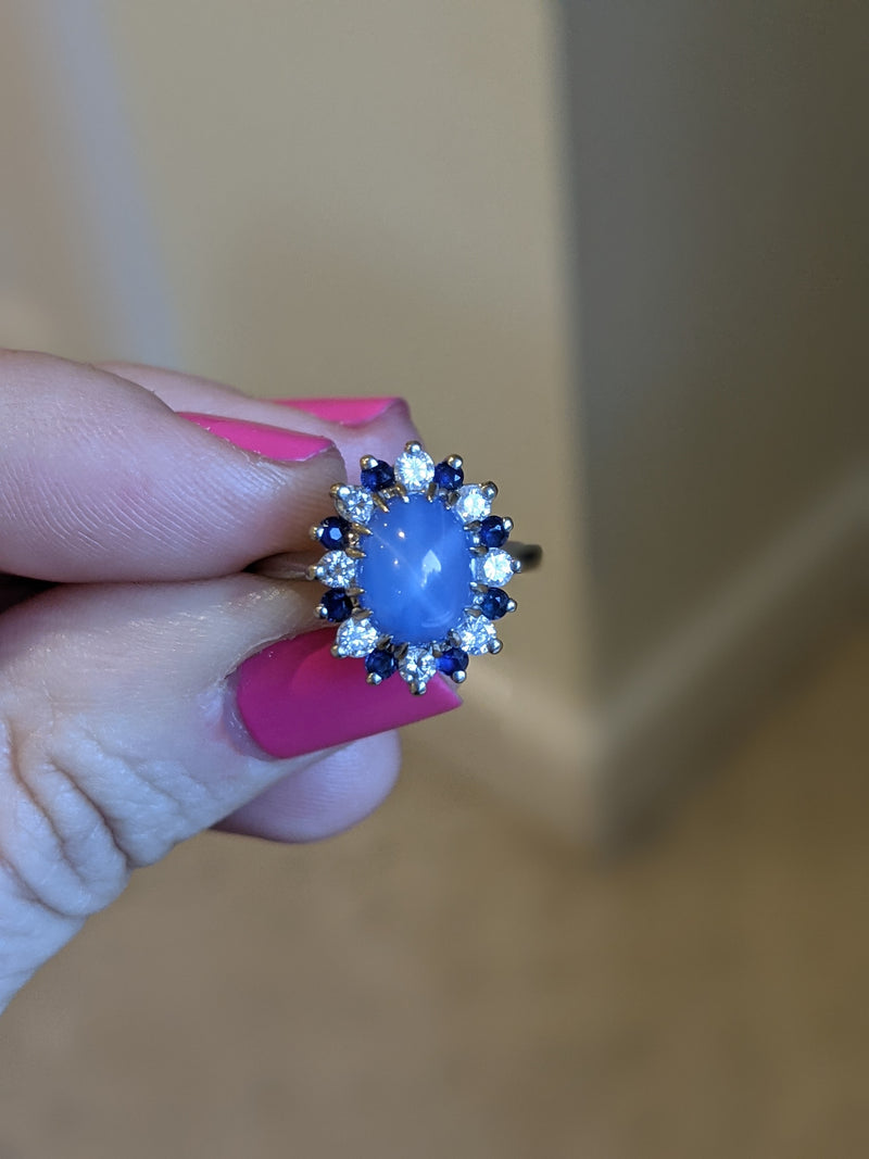 We used the round diamonds & blue sapphires form this piece in the ring.