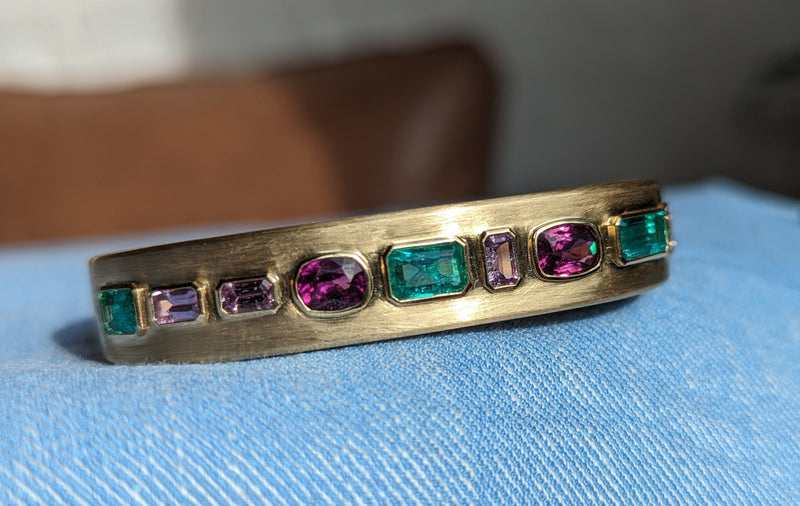 A custom bangle in an array of colored stones