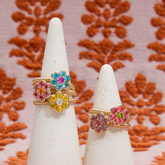 Five Blooms Medium Rings stacked on two ring cones