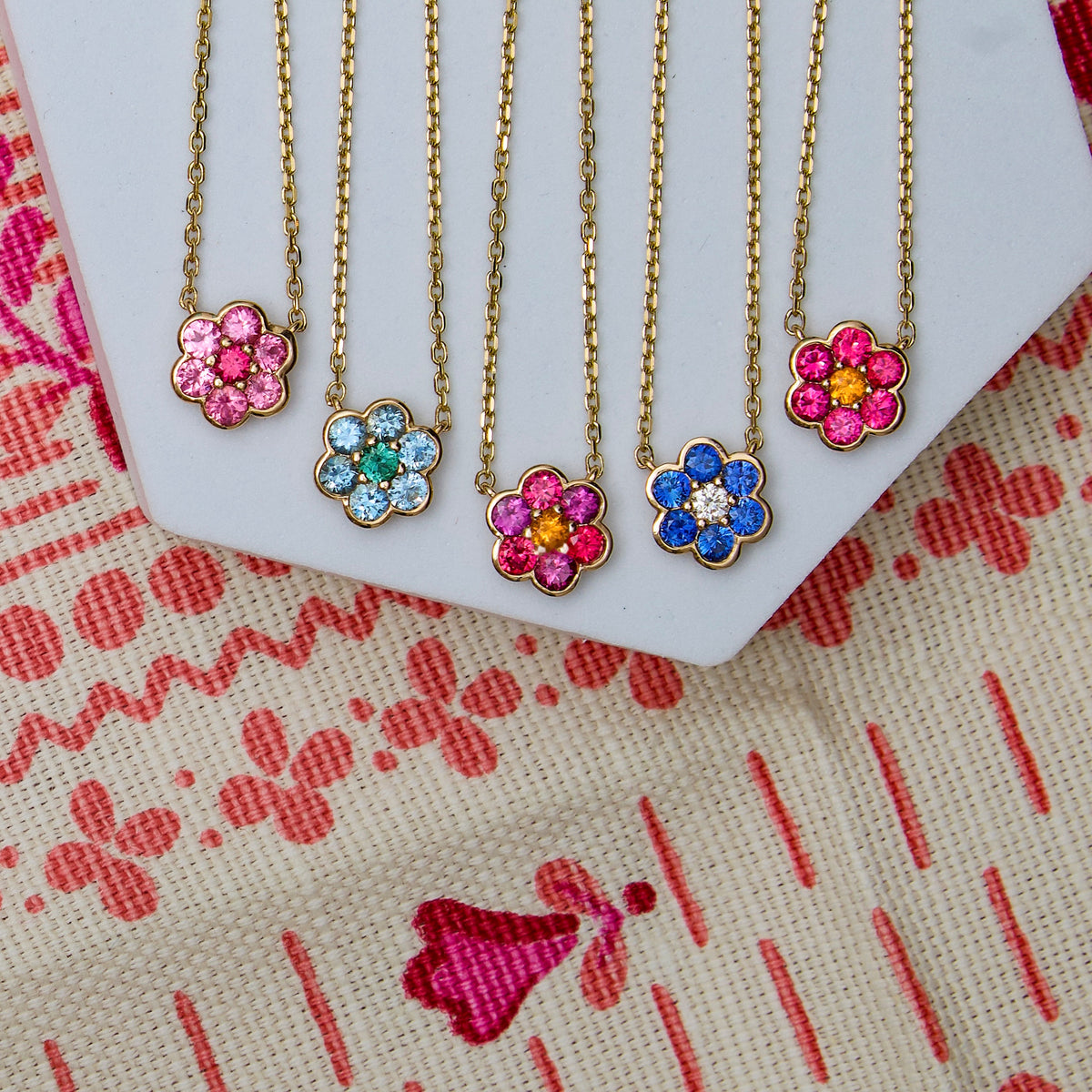 Five Blooms Small Pendant Necklaces in 14k yellow gold - Mehenge spinel and pink sapphire, aquamarine and tourmaline, Burmese spinel, plum garnet and spessartite garnet, blue sapphire and diamond, Burmese spinel and spessartite garnet