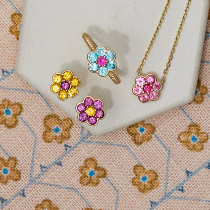 Blooms pieces together - Stud Earrings in yellow sapphire and grape garnet, Medium Ring in blue zircon and pink ruby, Small Pendant Necklace in Mehenge spinel and pink sapphire