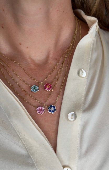 Small Blooms Pendant Necklaces layered on the neck - aquamarine and tourmaline, Burmese spinel and spessartite garnet, Mehenge spinel and pink sapphire, blue sapphire and diamond