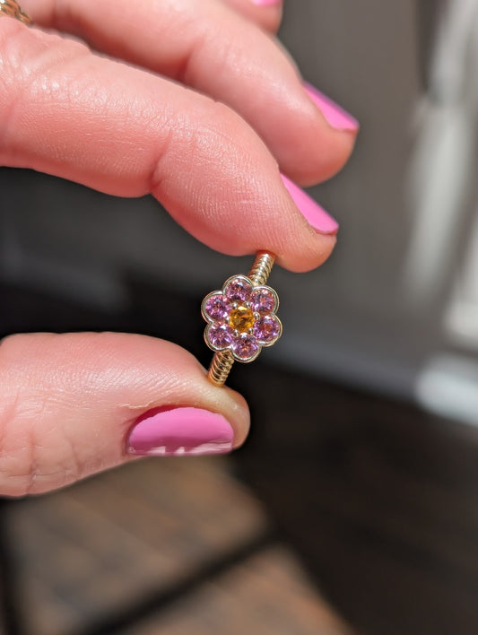 Blooms Medium Ring in pink tourmaline and citrine, close-up held in hand