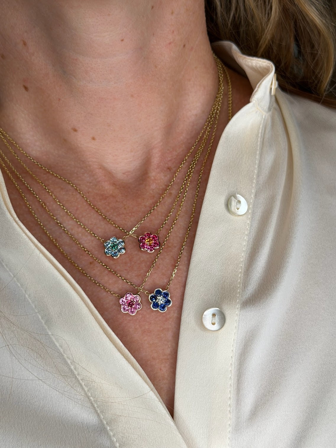 Four Small Blooms Pendants layered - aquamarine, Burmese spinel, pink sapphire and blue sapphire