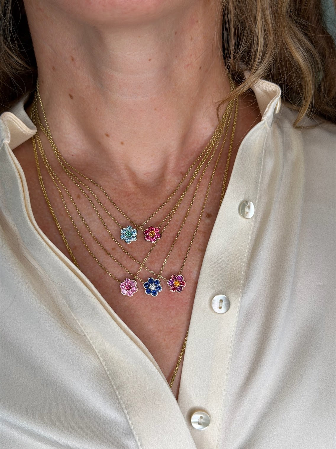 Five Small Blooms Pendants layered, including Burmese spinel, plum garnet and spessartite garnet