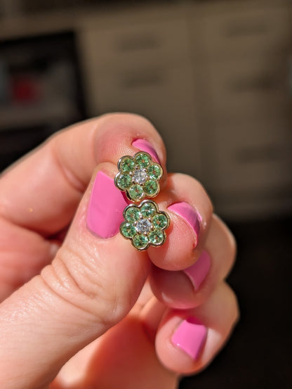 Blooms Stud Earrings in Merelani mint garnet with diamond center, pair held in hand
