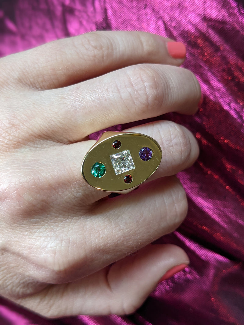 A bespoke memento ring using her original engagement ring diamond & her children's birthstones
