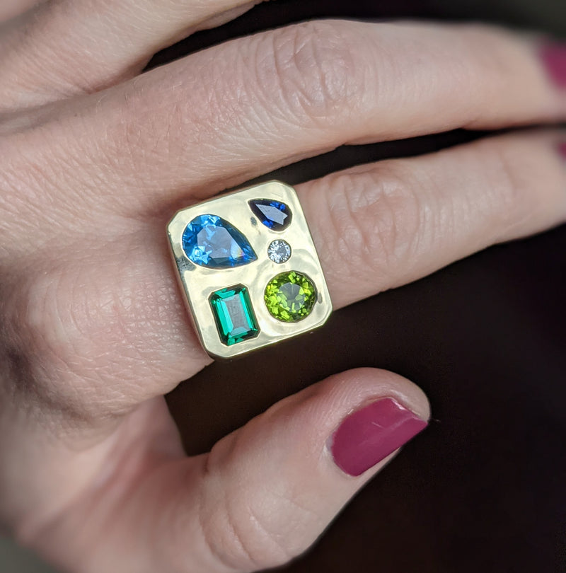 A bespoke memento ring combining existing heirloom pieces & originally sourced stones