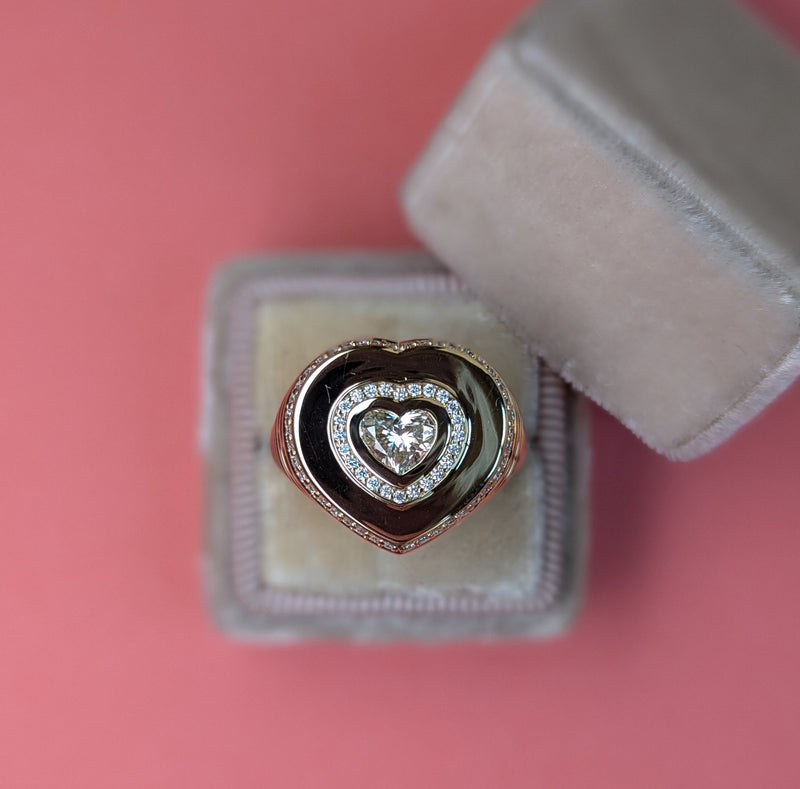 A diamond heart signet ring
