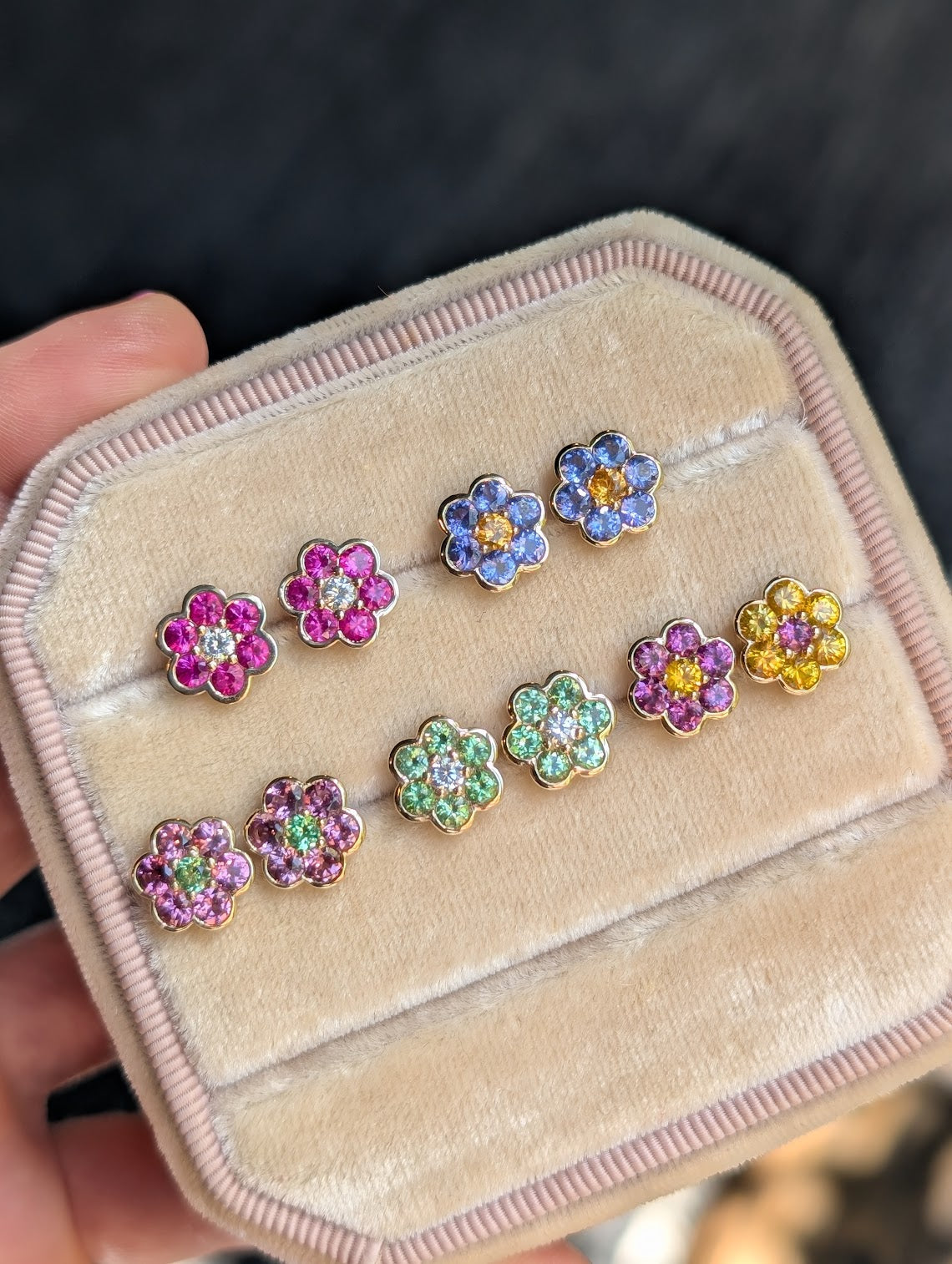 Blooms Stud Earrings in a velvet jewelry box - pink ruby and diamond, tanzanite and spessartite garnet, rhodolite garnet and Merelani mint garnet, yellow sapphire and grape garnet