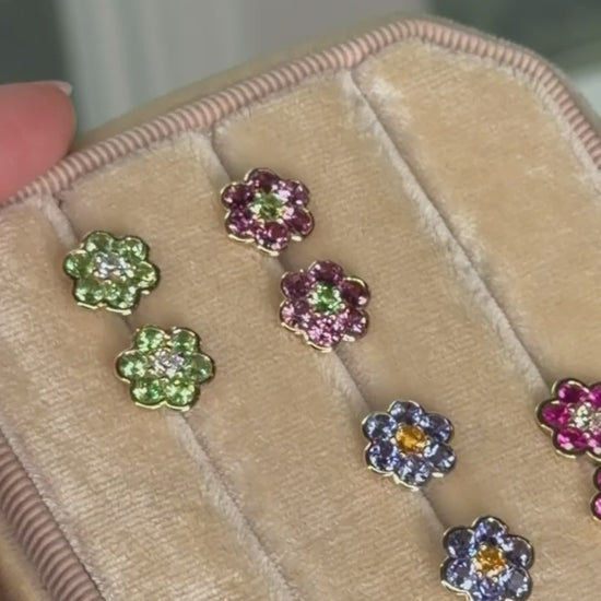Video of Blooms Stud Earrings in a velvet jewelry box - Merelani mint garnet and diamond, rhodolite garnet and Merelani mint garnet, tanzanite and spessartite garnet, pink ruby and diamond