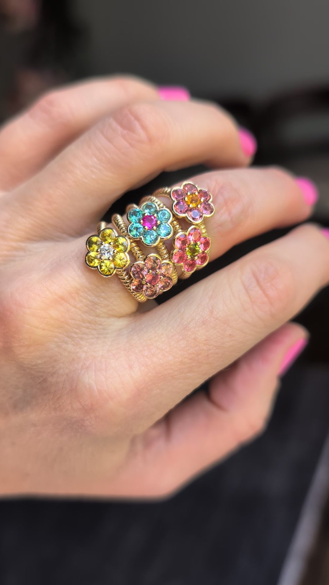 Video of five Blooms Medium Rings stacked on the hand - yellow sapphire and diamond, blue zircon and pink ruby, Tanzanian zircon and Mehenge spinel, pink tourmaline and citrine, Mehenge spinel and tourmaline