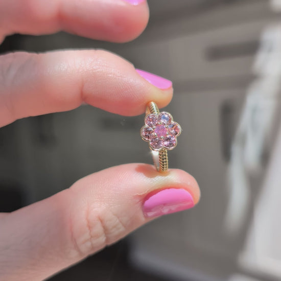 Video of the Blooms Medium Ring in Tanzanian zircon and Mehenge spinel held in sunlight