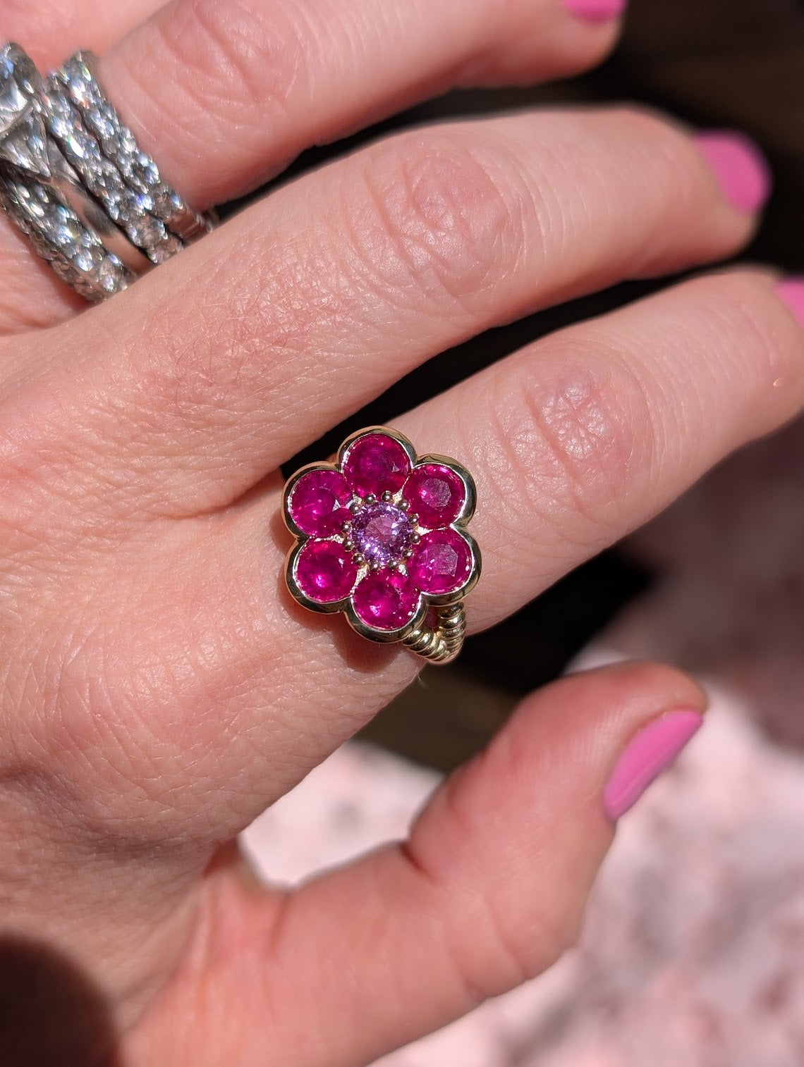 Blooms Large Ring in pink ruby and pink sapphire, close-up worn on the hand